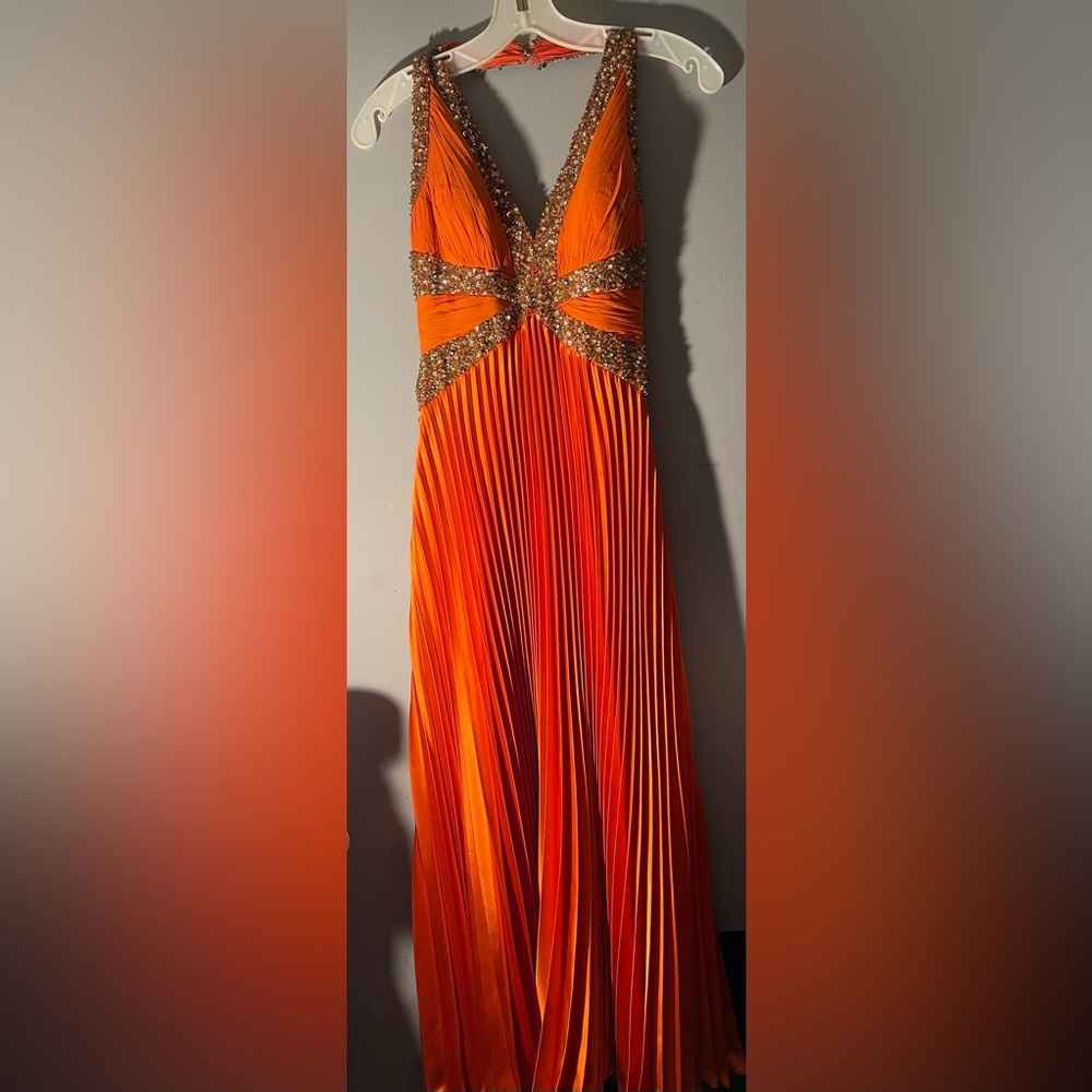 Orange pleated dress with gold sequins